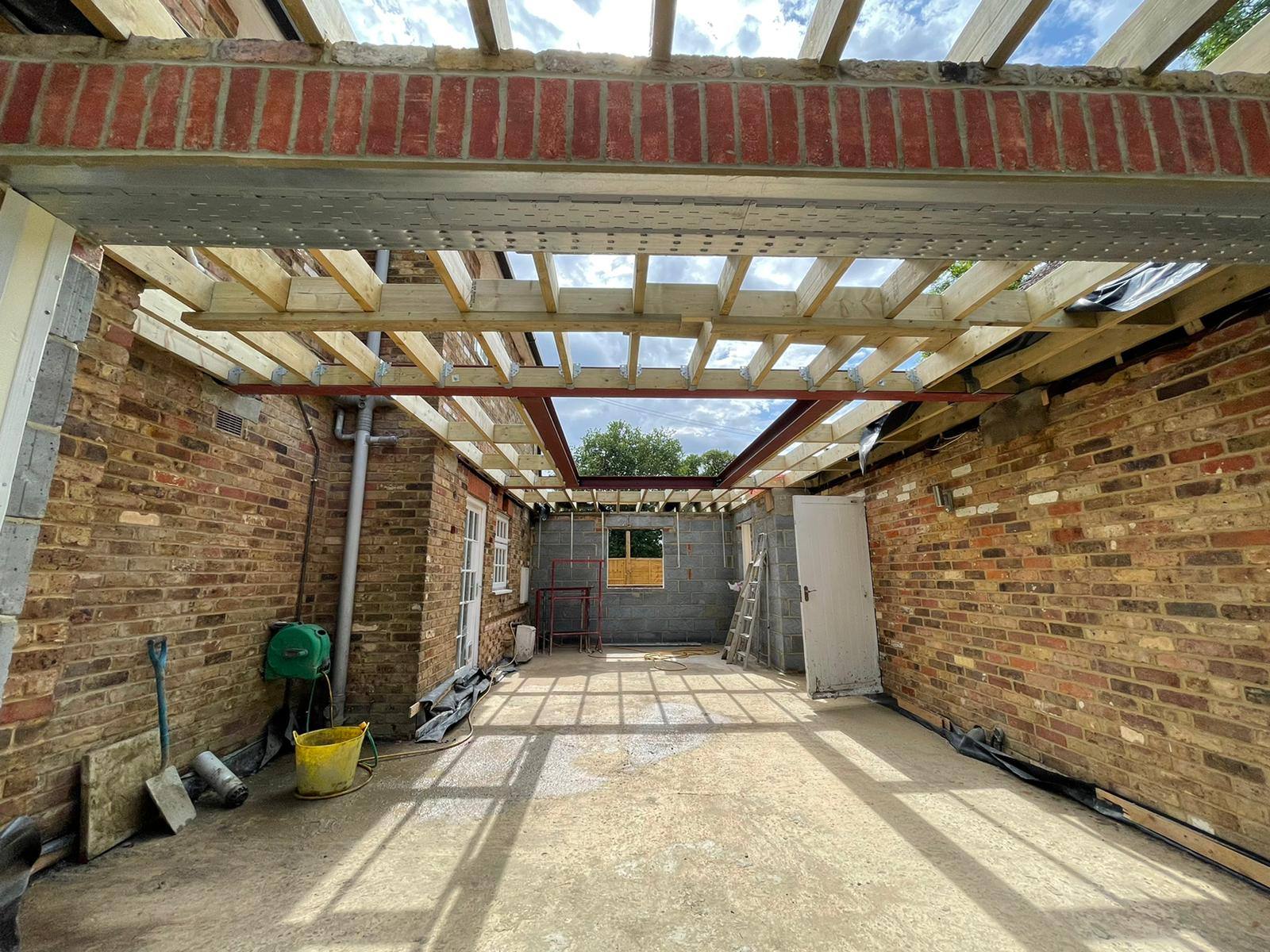 Rear extension mid-build with steel beam and roof joists